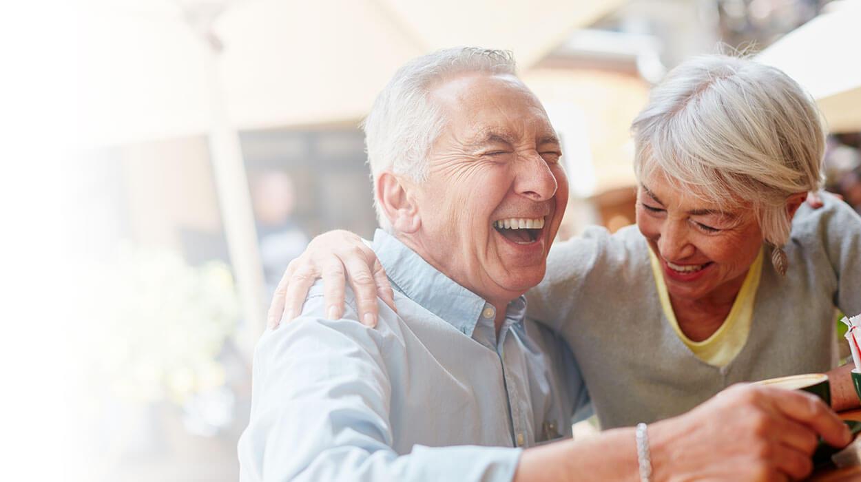 elderly couple having fun at The Delaney at Georgetown senior living community