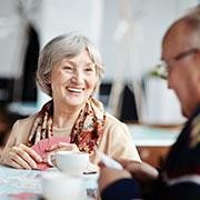 small size - elderly woman enjoying a cup of tea at The Delaney at Georgetown senior living retirement community