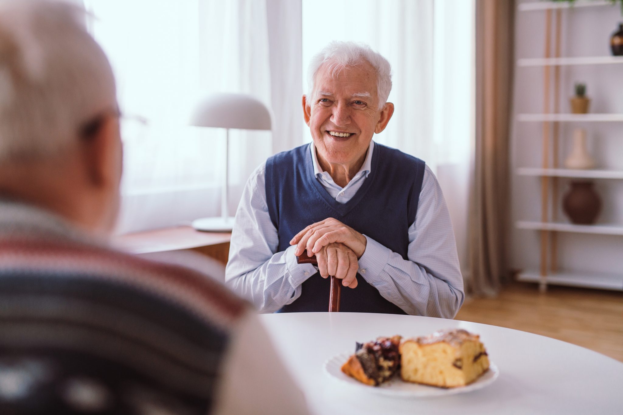 two men sitting at a table